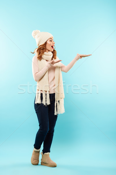 Full length portrait of a smiling young girl Stock photo © deandrobot