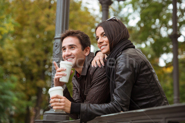 Couple looking on something outdoors  Stock photo © deandrobot