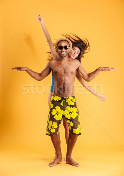 Stock photo: Loving smiling couple in swimwear having fun