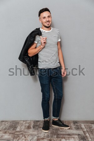 Full length of serious man burglar with rope and gun Stock photo © deandrobot