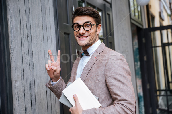 Jóvenes nerd hombre signo Foto stock © deandrobot