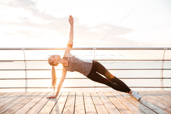 Stockfoto: Fitness · vrouw · yoga · buitenshuis · strand · pier