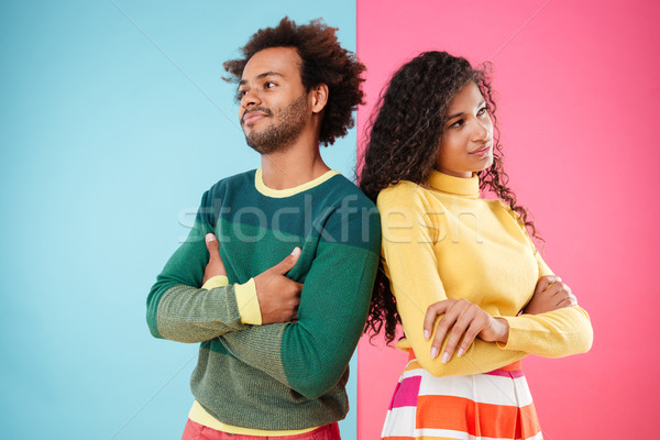 Offended young couple standing with arms crossed Stock photo © deandrobot