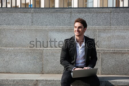 Runner with bag talking at phone near the stairs Stock photo © deandrobot
