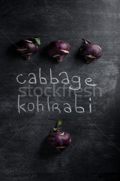 Stock photo: Cabbage kohlrabi over dark background.