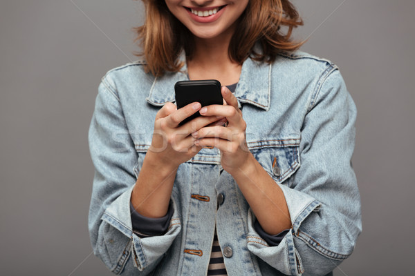Cropped image of a cheery pretty teenage girl Stock photo © deandrobot
