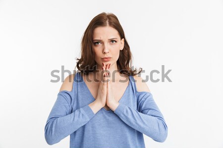 Portrait of a young woman begging Stock photo © deandrobot