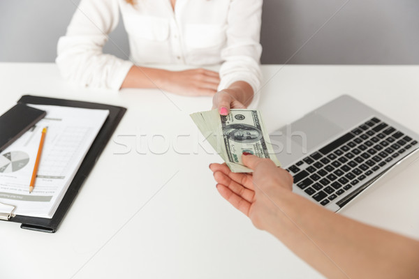 Close up portrait of hand holding cash Stock photo © deandrobot