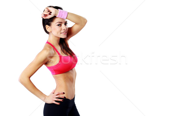 Young beautiful sport woman wiping off sweat isolated on a white background Stock photo © deandrobot