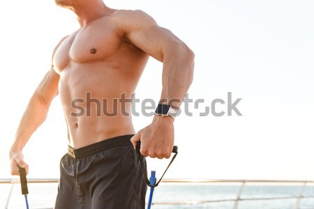 Young muscular man isolated on white Stock photo © deandrobot