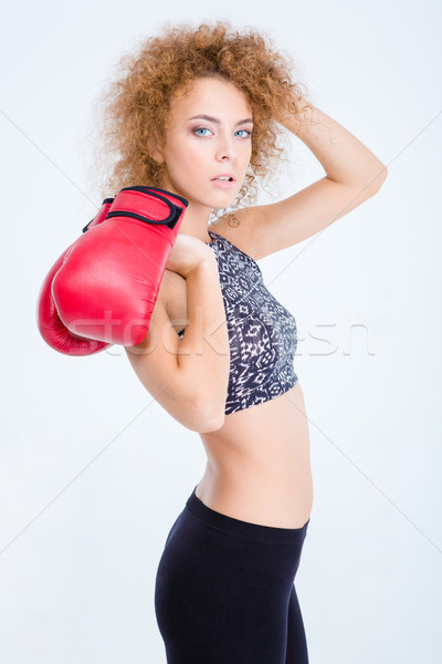 Sports woman standing with boxing gloves Stock photo © deandrobot