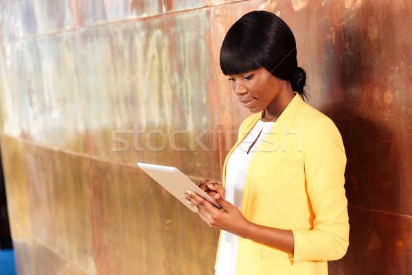 Businesswoman using tablet computer Stock photo © deandrobot