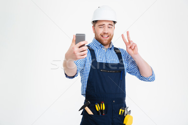 улыбаясь строителя мира знак Сток-фото © deandrobot