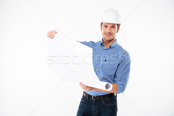 Lächelnd junger Mann Gebäude Ingenieur Helm schauen Stock foto © deandrobot