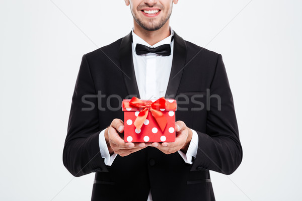 Cropped businessman with gift Stock photo © deandrobot