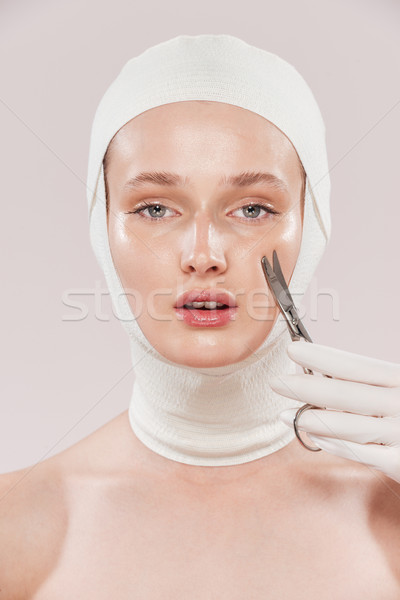 Unusual image of model and scissors Stock photo © deandrobot