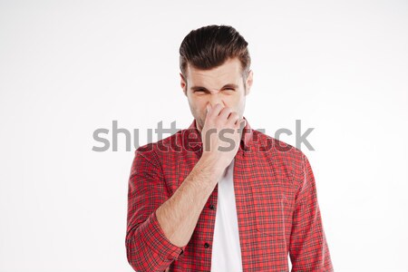 Man covering his nose Stock photo © deandrobot