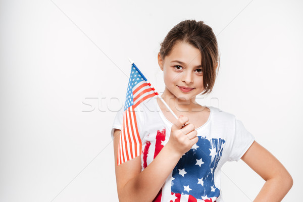 Happy young girl holding USA flag Stock photo © deandrobot