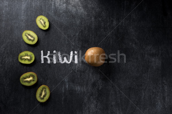 Stock photo: Kiwi over dark chalkboard background