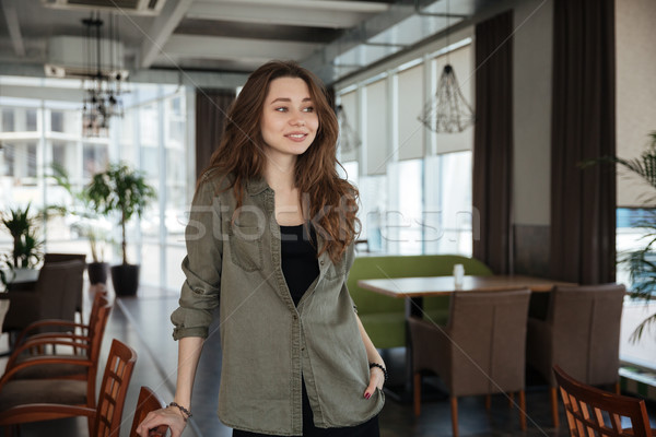 Woman standing in cafe Stock photo © deandrobot