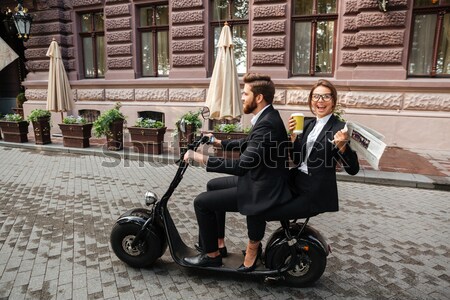 Vista lateral gritando barbado hombre de negocios moto moderna Foto stock © deandrobot