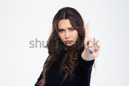 Confused brunette woman in sweater showing gun gesture Stock photo © deandrobot