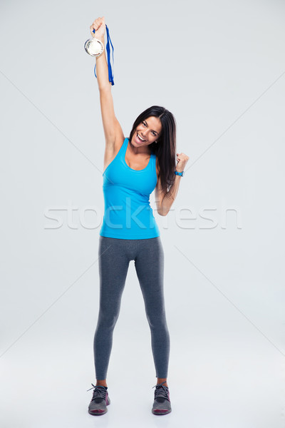 Boldog fitnessz nő tart érem teljes alakos portré Stock fotó © deandrobot