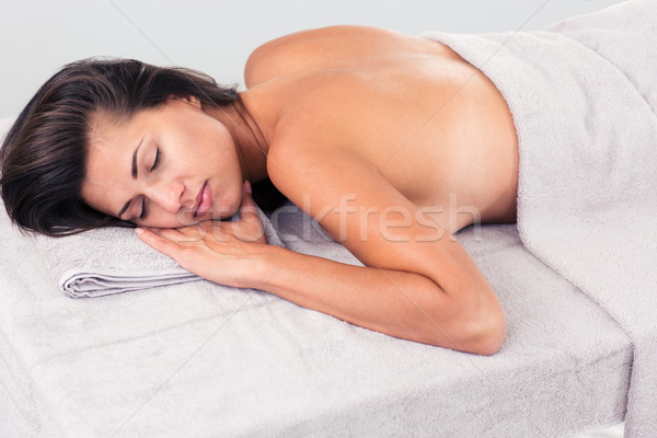 Relaxed woman lying on massage lounger  Stock photo © deandrobot