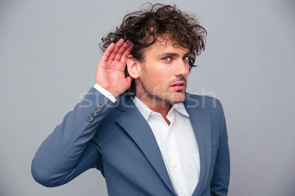 Businessman making gesture to her you Stock photo © deandrobot
