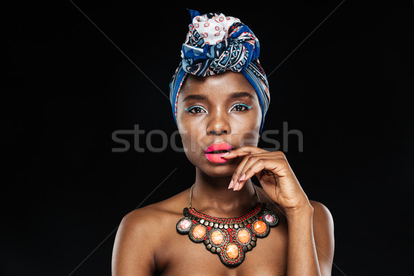 Close-up portrait of attractive woman with hand on lips Stock photo © deandrobot