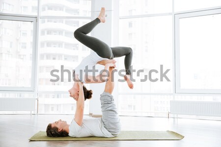 [[stock_photo]]: Deux · femmes · jambes · yoga · centre · deux