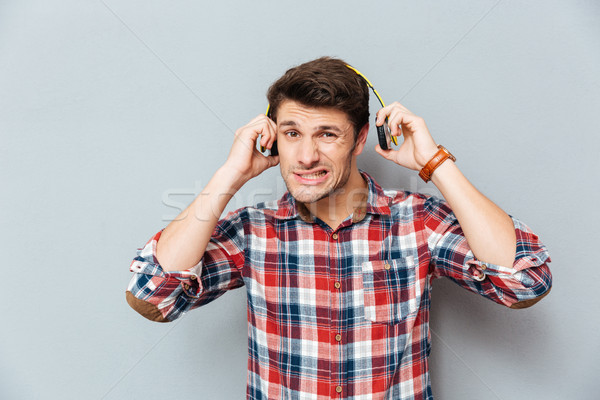 Megszégyenített férfi haj technológia szomorú fejhallgató Stock fotó © deandrobot