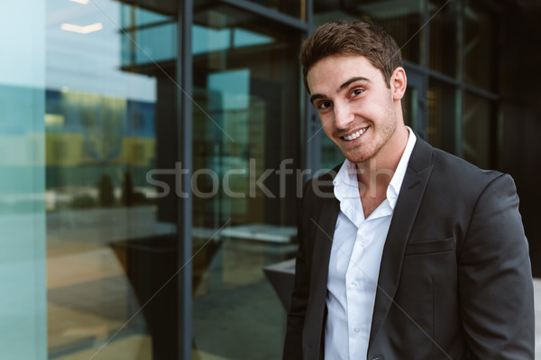 Stock photo: Happy business man near the office
