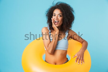 Stock photo: Portrait of a happy smiling young woman in beach hat