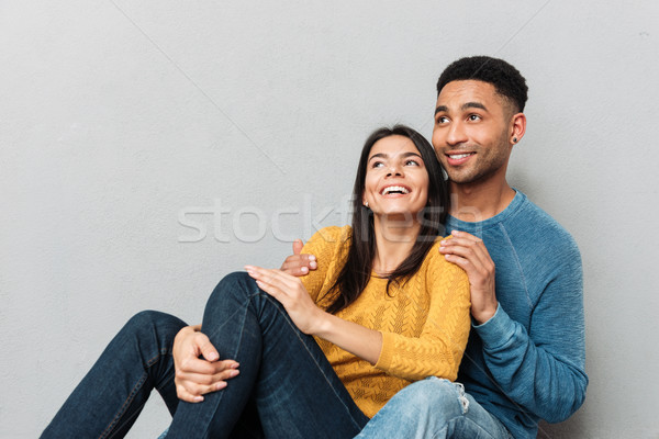 Man and woman looking up at empty space Stock photo © deandrobot