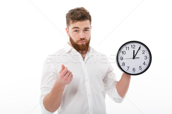 Tired man in business clothes showing time is money gesture Stock photo © deandrobot