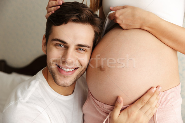 человека обнять живота беременна жена Сток-фото © deandrobot