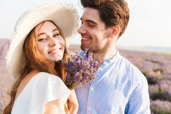 Close up of happy young couple embracing at the lavender Stock photo © deandrobot
