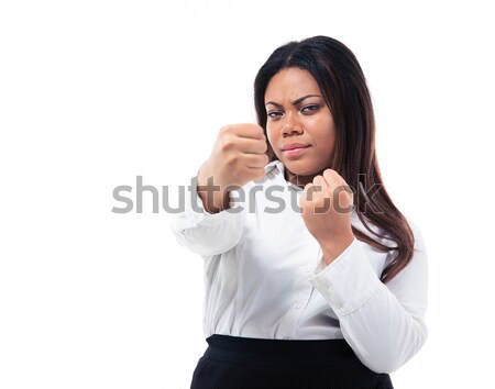 Afro american businesswoman with finger over lips Stock photo © deandrobot