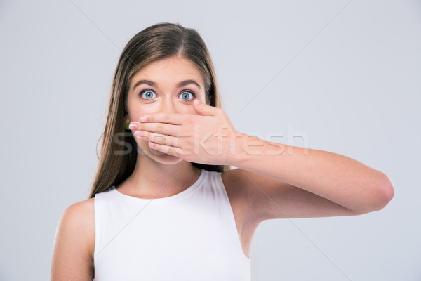 Female teenager covering her mouth Stock photo © deandrobot
