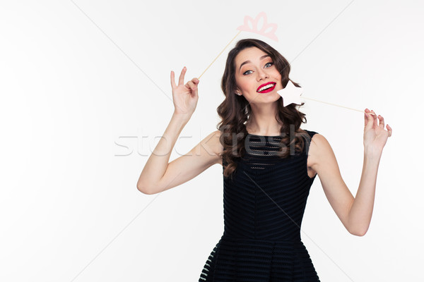 Attractive happy woman using fake crown props and magic stick  Stock photo © deandrobot