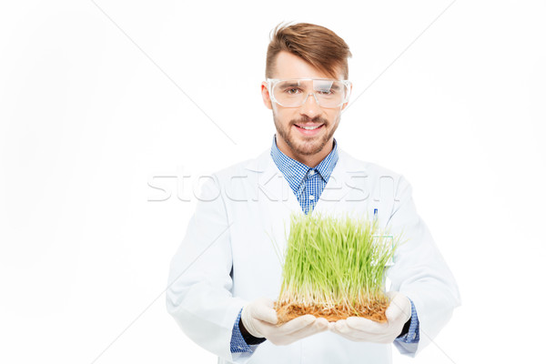 Happy male engineer showing a modified plants Stock photo © deandrobot