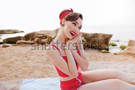 Pin up girl in headband posing with pineapple and watermelon Stock photo © deandrobot