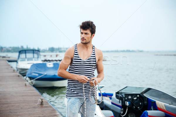 Przystojny młodych marynarz liny molo Zdjęcia stock © deandrobot