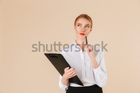 Vertical image of woman in bathrobe holding book Stock photo © deandrobot