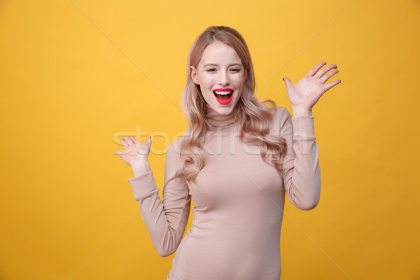 Happy young blonde lady with bright makeup lips Stock photo © deandrobot