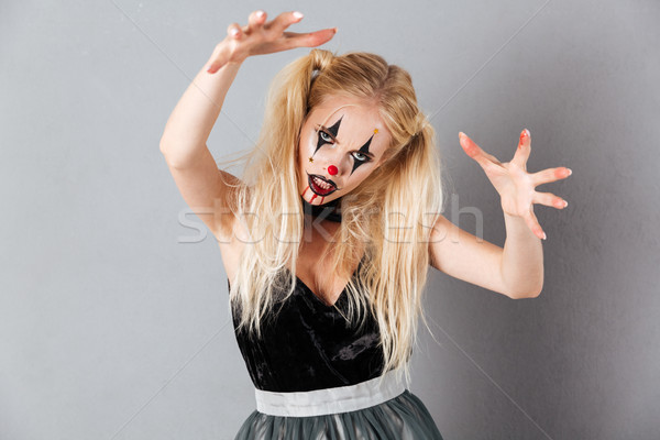 Mulher loira halloween compensar posando estúdio Foto stock © deandrobot