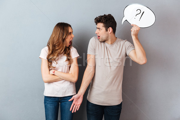 Portrait of a young upset couple having an argument Stock photo © deandrobot