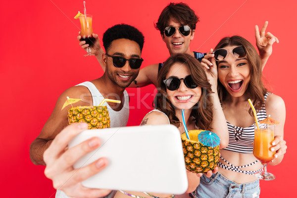 Group of happy cheerful multiracial friends Stock photo © deandrobot
