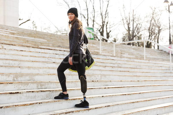 Photo of caucasian disabled woman in sportswear with prosthetic  Stock photo © deandrobot